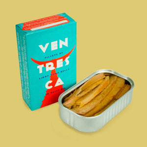 La Narval Light Tuna Belly (Ventresca) In Olive Oil - The packaging (angled) beside an opened tin