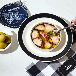 An opened tin of A Conserveira Octopus in Olive Oil
