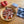 Load image into Gallery viewer, A plate of freshly chopped tomatoes with Açor Tuna Belly pieces laid on top