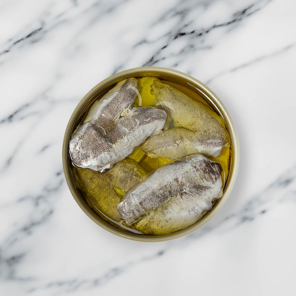 Artesanos Alalunga European Hake Cheeks in Olive Oil - served in an opened tin