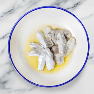 Artesanos Alalunga European Hake Cheeks in Olive Oil - beautifully served