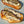 Load image into Gallery viewer, A sardine placed on toasted bread with a creamy sauce