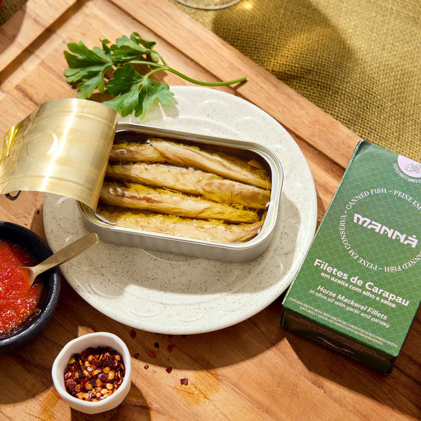 An opened tin of Manná Horse Mackerel Fillets in Olive Oil with Garlic and Parsley