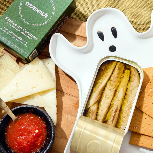 An opened tin of Manná Horse Mackerel Fillets in Olive Oil with Garlic and Parsley