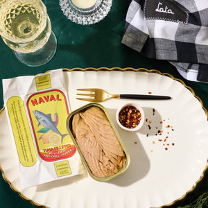 A top view of an opened tin of Naval Tuna Fillets with Lemon and Chili Pepper