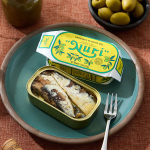 An opened tin of Nuri Sardines in Olive Oil