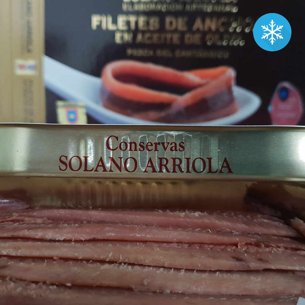 An angled view of an opened tin of Solano-Arriola Extra Large Anchovy Fillets in Olive Oil