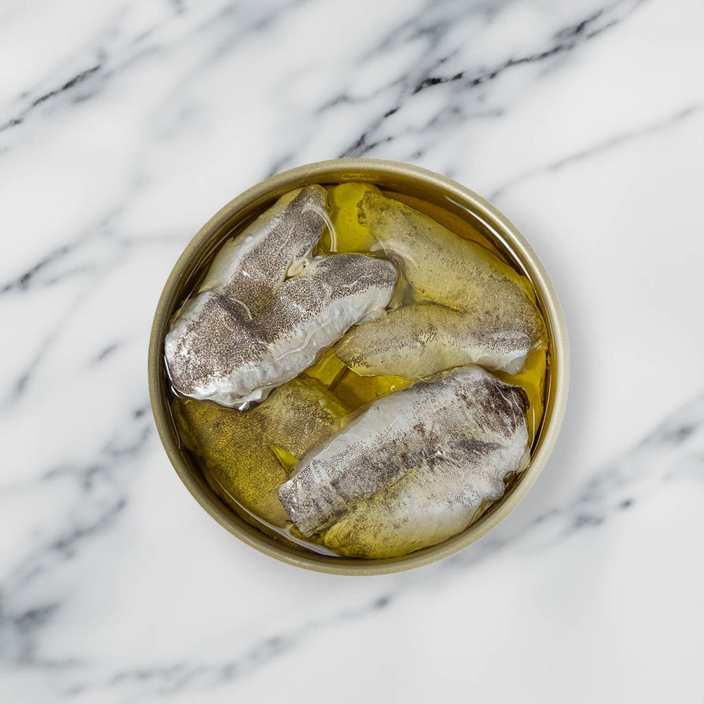 Artesanos Alalunga European Hake Cheeks in Olive Oil - served in an opened tin