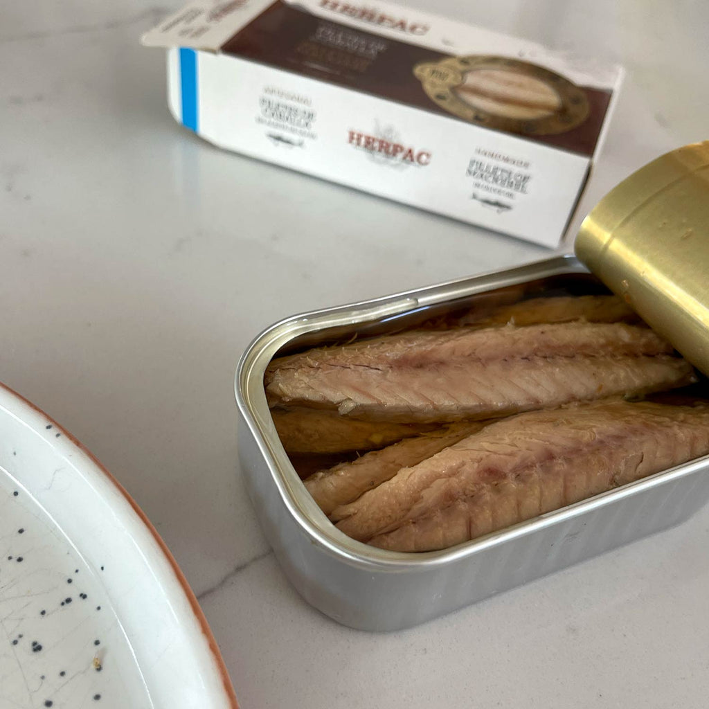 An opened tin of Herpac Fillets of Mackerel in Olive Oil