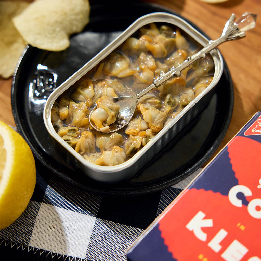 An opened tin of La Narval Cockles in Lemon