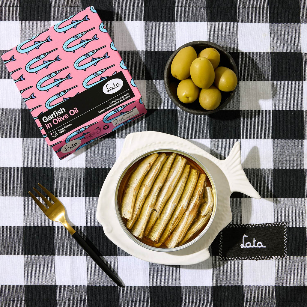 An opened tin of Lata Garfish in Olive Oil