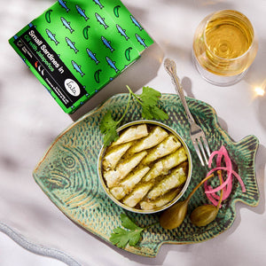 An opened tin of the Lata Small Sardines in Oil with Jalapeños