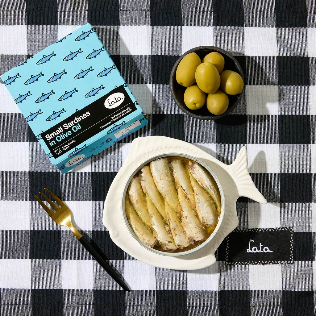 An opened tin of Lata Small Sardines in Olive Oil