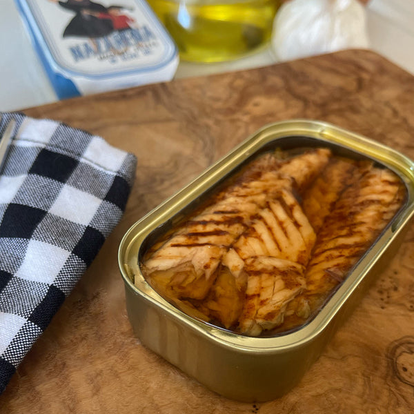 An opened tin of Nazarena Mackerel Fillets in Olive Oil