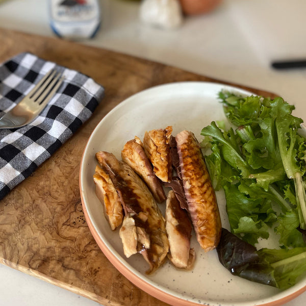 Nazarena Mackerel Fillets in Olive Oil, served on a plate with salad