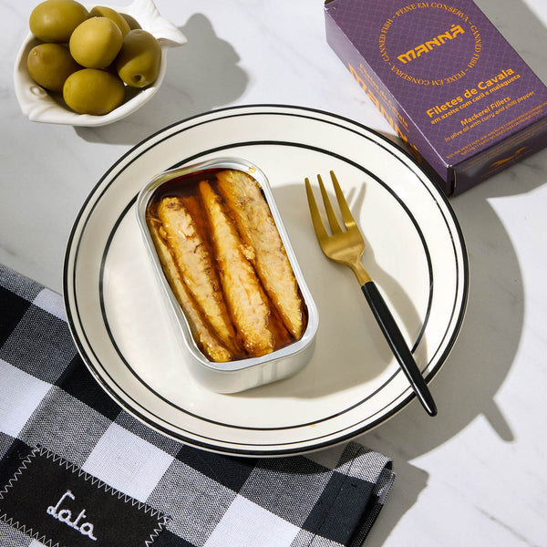 An opened tin of Manná Mackerel Fillets in Olive Oil with Curry and Chilli Pepper