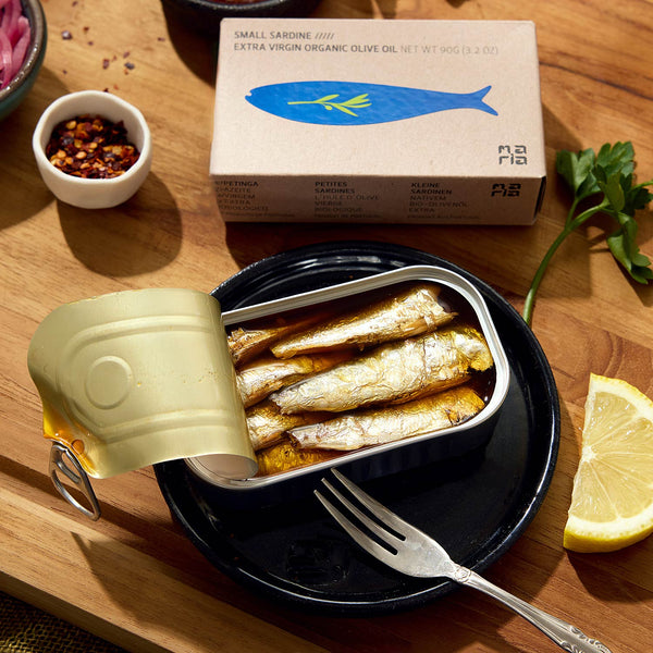 An opened tin of Maria Organic Small Sardines in EVOO