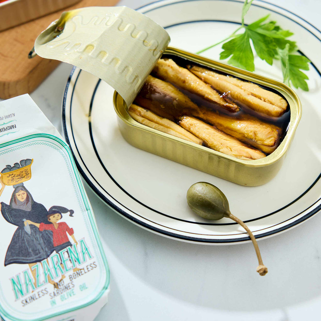 An opened tin of Nazarena Skinless and Boneless Sardines in Olive Oil