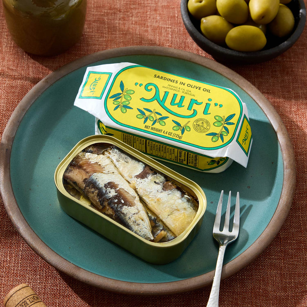 An opened tin of Nuri Sardines in Olive Oil 