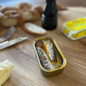 Nuri Spiced Sardines in Olive Oil - served in an opened tin and some bread visible in the background