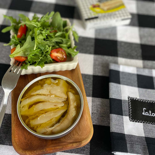 Samare Spiced Cod in Extra Virgin Olive Oil served in an opened tin alongside some salad