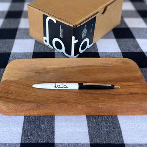 A Lata pen in front of a cardboard box with the company logo