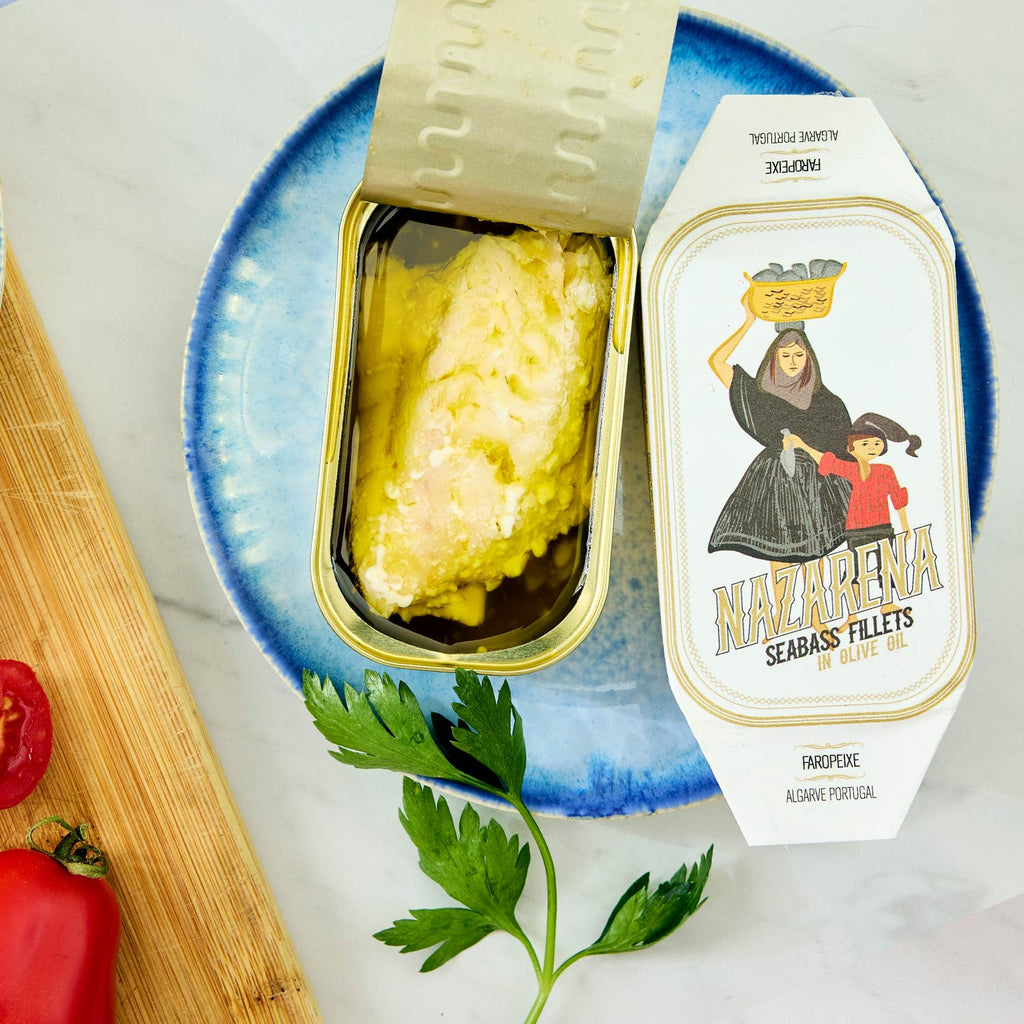 An opened tin of Nazarena Seabass Fillets in Olive Oil
