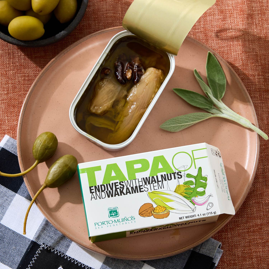 An opened tin of Porto-Muiños Endives with Walnuts and Wakame Stem