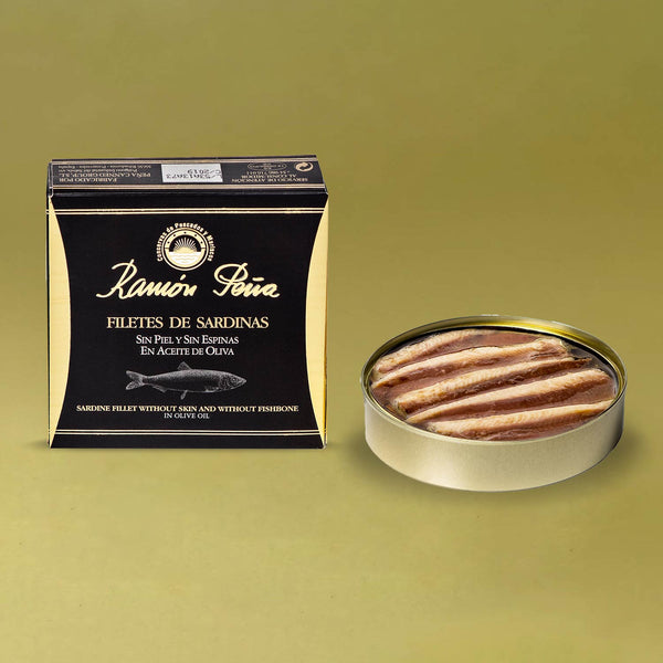 Ramón Peña Boneless and Skinless Sardine Fillets - an opened tin beside the packaging