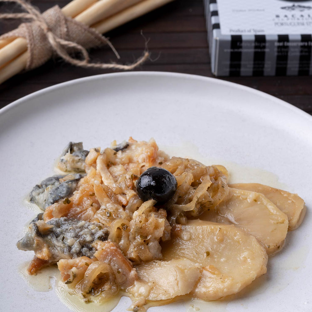 An angled photo of the plated Real Conservera Portuguese Style Cod