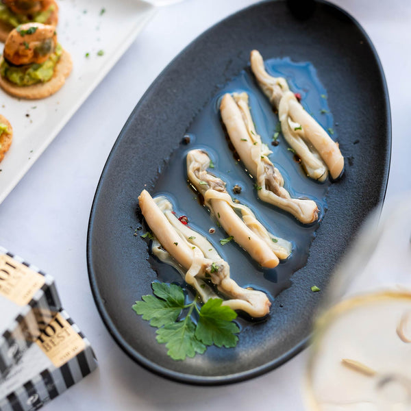 A top view of the Real Conservera Española Razor Clams served in brine