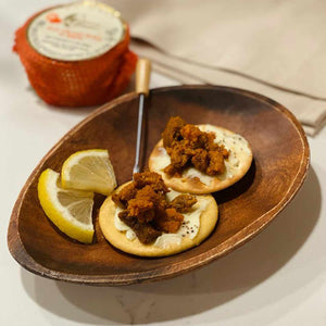 Conservas de Cambados Sea Urchin Caviar served on crackers with lemon