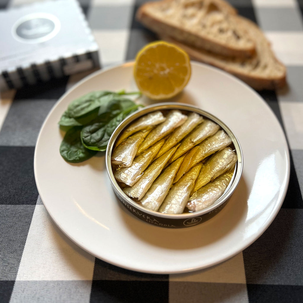 Real Conservera Española Small Sardinas with Lemon in Olive Oil served in an opened tin